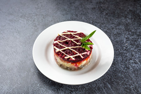 salad fur coat on a white plate on a gray backgroundの写真素材
