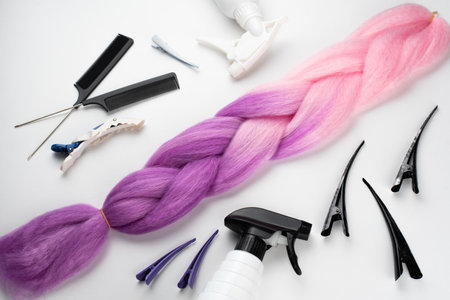 Kanekalon two- color-artificial hair lilac and light lilac color for braiding braids, lying on a white backgroundの写真素材