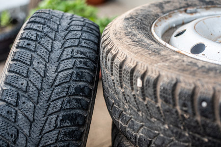 A stylish woman relaxing against a fence in the middle of a busy city day.の写真素材