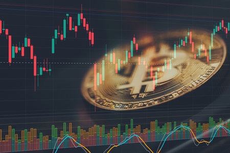 Bitcoin with market graph reflectionの写真素材