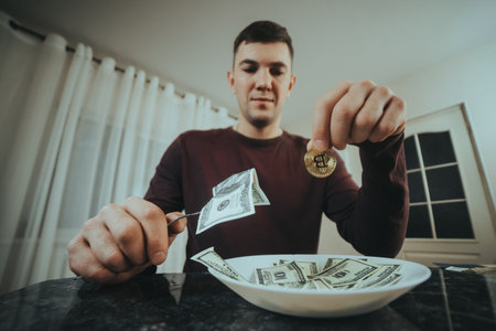 Man holding bills and coin, representing traditional and digital investment options.の写真素材