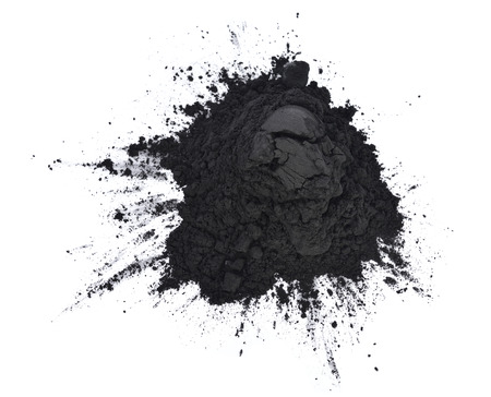 Charcoal powder isolated on a white backgroundの写真素材