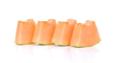Cantaloupe melon slices on white backgroundの写真素材