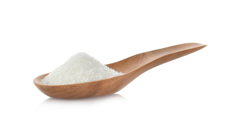 Salt in wooden spoon on white backgroundの写真素材