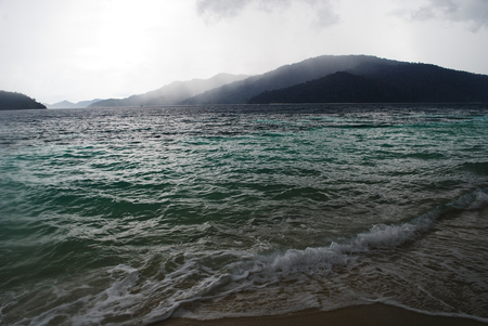 Raining on the beach at Lipe, Thailandの写真素材