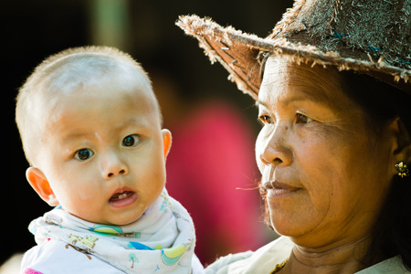 Grandmother holding grandchildのeditorial素材