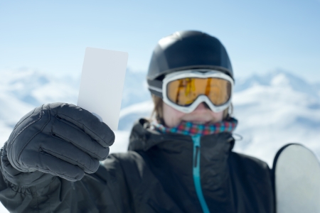 Skipass and girl with ski goggles. Concept to illustrate ski admission feeの写真素材
