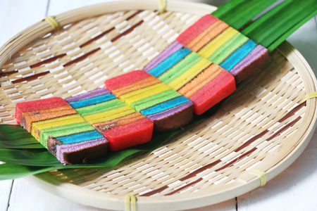 Colourful layer cake or Kek Batik Sarawak on a bamboo trayの写真素材