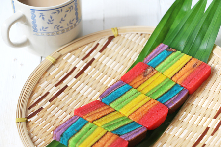 Colourful layer cake or Kek Batik Sarawak on a bamboo trayの写真素材