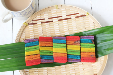 Colourful layer cake or Kek Batik Sarawak on a bamboo trayの写真素材