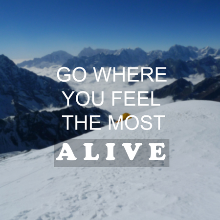 Blurry Snow mountain background with Inspirational quote - Go where you feel the most alive