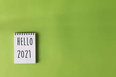 Note pad with words written - Hello 2021. New year's eve conceptの写真素材