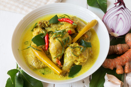 Malaysian traditional food called 'Ayam masak Lemak'. Chicken cooked in coconut milk and spiceの写真素材