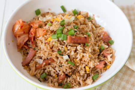 Close-up shot of Fried rice with Kimchi in white bowlの写真素材