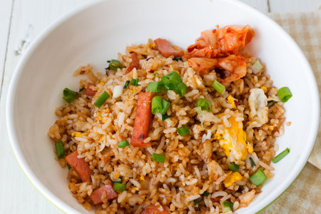 Close-up shot of Fried rice with Kimchi in white bowlの写真素材