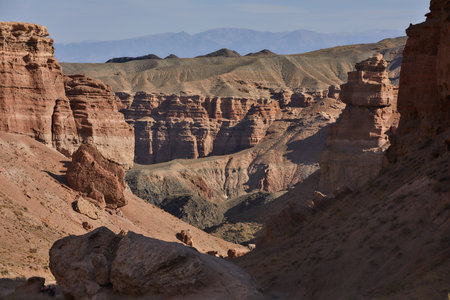 Sandy canyon with red vulcanic rocks. Charyn. Kazakhstan. National park, breathtaking view. High...