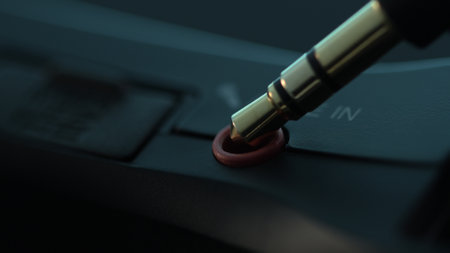 Audio Jack Plugged into Sound Device Line In. Close-up, shallow dof.