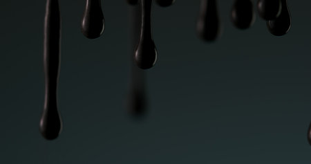 Oil Drips in Dim Light. Close-up, shallow dof.の写真素材