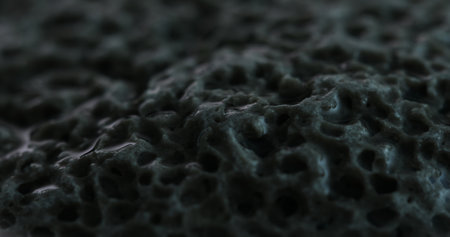 Ultra Close-Up of a Highly Porous Stone Surface. Dolly shot, shallow dof.