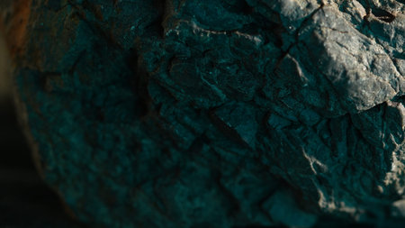 Rock texture with teal shadow and warm light detail natural background