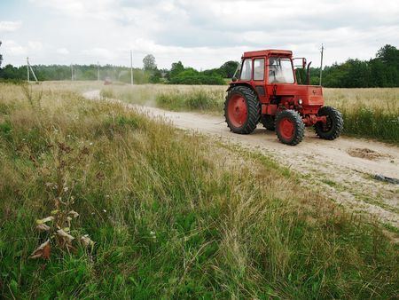 tractor goes on village roadの写真素材