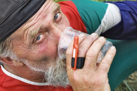 The sportsman drinking water  after finish competitionの写真素材