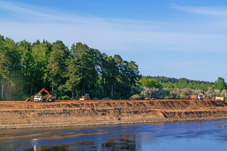 Construction of Vitebsk hydroelectric power station. Preparation of the river bank near village for protection against a flood.の写真素材