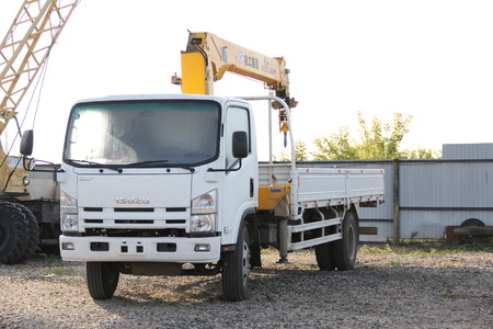 Great white auto truck crane standing on a construction site - Russia, Crimea - September, 21, 2016のeditorial素材