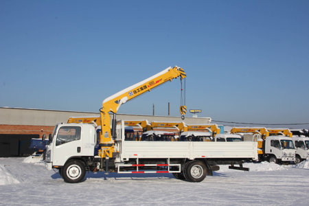 Great white auto truck crane standing on a construction site in winter - Russia, Crimea -January, 21, 2016のeditorial素材