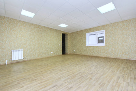 Interior empty office light room with green wallpaper without furniture in a new buildingの写真素材