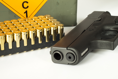 Bullets, gun and box with new ammunitionの写真素材