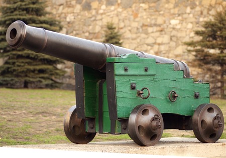 old cannon on wheels is in the fortressの写真素材