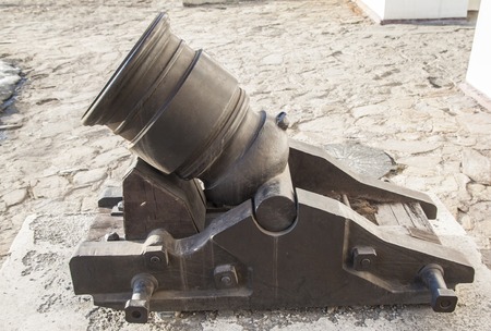 old cannon on wheels is in the fortressの写真素材