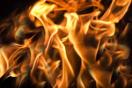 orange flames on a black background fireの写真素材