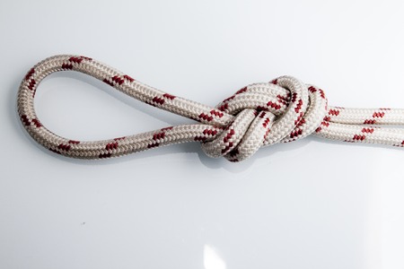 knot on a rope on a white backgroundの写真素材
