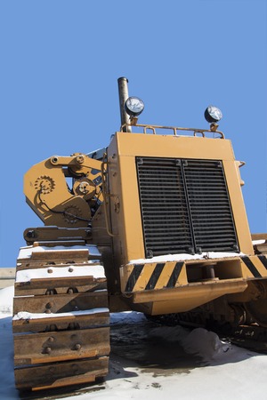 tractor stands on the snowの写真素材