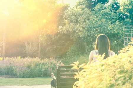 She sat waiting for someone sun\'s evening in tone style vintage.の写真素材