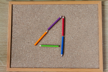 Board and numbered and colored pencilsの写真素材