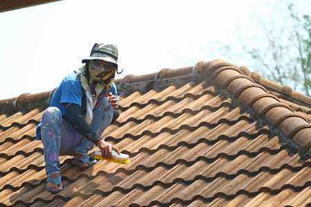 this is photo working man at roof.の写真素材