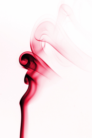 this is Movement of smoke colored with white background.の写真素材