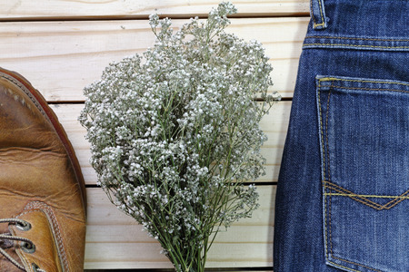 dry flowers on jean and boots .effcet vintage style blur nosieの写真素材