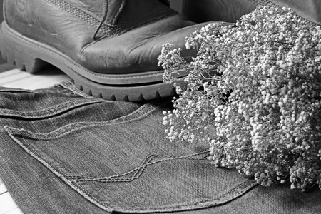 dry flowers on jean and boots .effcets back and white color.の写真素材