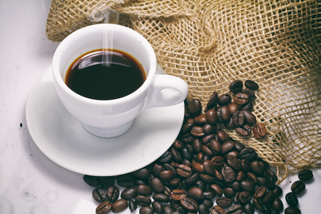 black coffee beans on white backgroundの写真素材