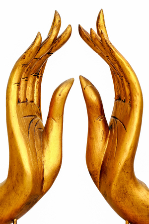 Buddha hand make from wood isolated on whiteの写真素材