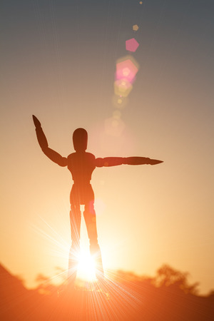 Shadow of wood robot in Morning sun yogaの写真素材