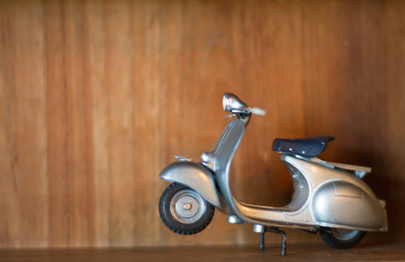 motorcycle toy on thew wooden tableの写真素材