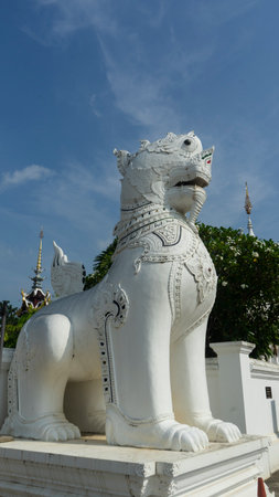 A giant lion stood guard at the entrance to the temple.の写真素材