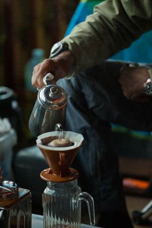 Drip brewing, filtered coffee, or pour-over is a method which involves pouring water over roasted, ground coffee beans contained in a filter.の写真素材