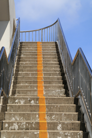Overpass stairs in the city. Overpass walkway with blue sky background,Staircase of overpassの写真素材