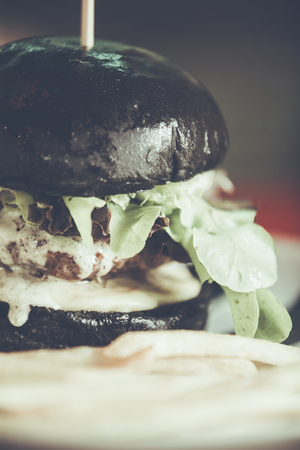 charcoal beef burger with French friesの写真素材